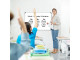 Teacher using a non-magnetic whiteboard during an interactive lesson with learners in a school classroom