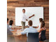 PARROT Whiteboard Non-Magnetic 1500 X 1200mm - Office Presentation Presenter using a PARROT non-magnetic whiteboard to explain information during an office meeting